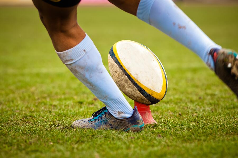 bigstock-rugby-player-preparing-to-kick-237862285