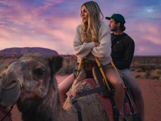 Couple on tour with Uluru Camel Tours - Tourism NT - Nic Morley